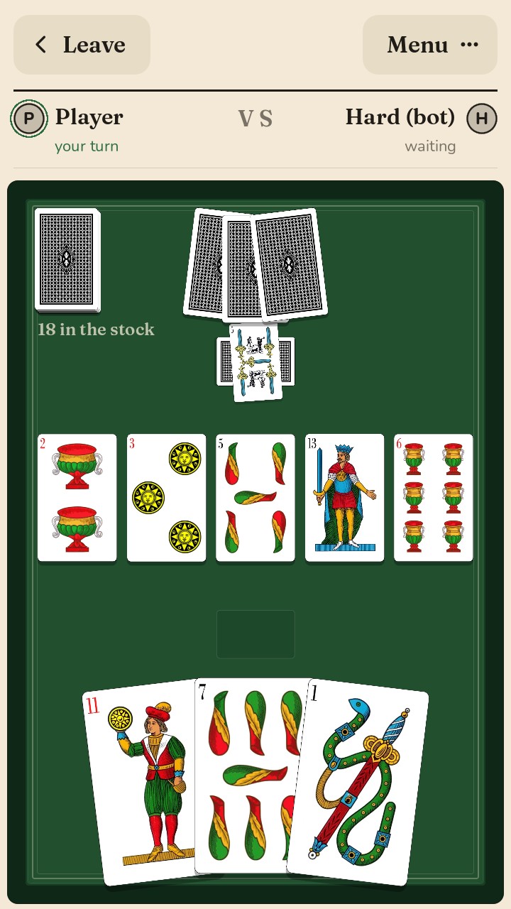 Scopa table with the Neapolitan deck: five cards on the table, the opponent&rsquo;s pile with a scopa laid crosswise, three cards in hand
